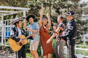 Learning Spanish can open doors to authentic cultural experiences, like enjoying live music and singing along with traditional Mexican musicians