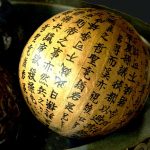 A globe covered with Asian writing instead of country borders, representing the idea of fully immersing yourself in a language by seeing the world through its script and culture